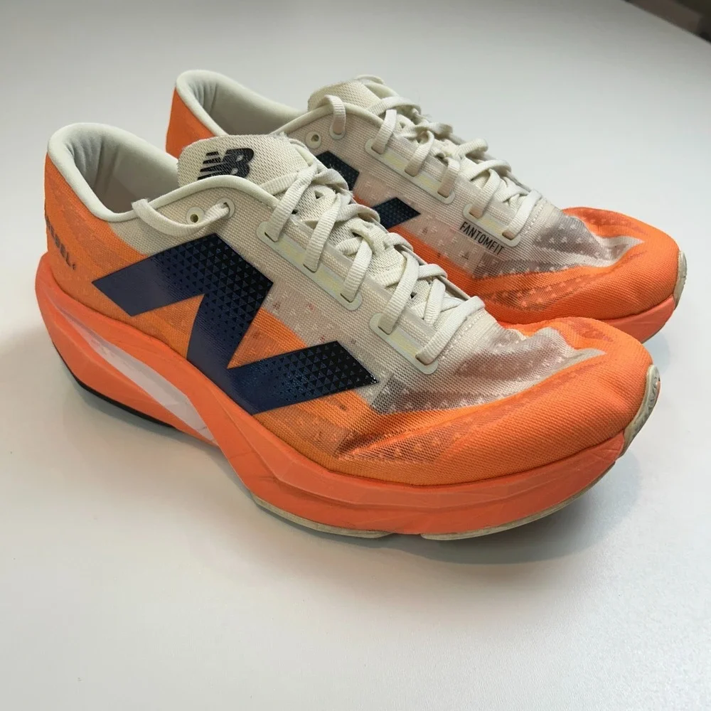 New Balance FuelCell Rebel v4 Mens 11 Wide 2E Orange White Running Shoes MFCXCO4